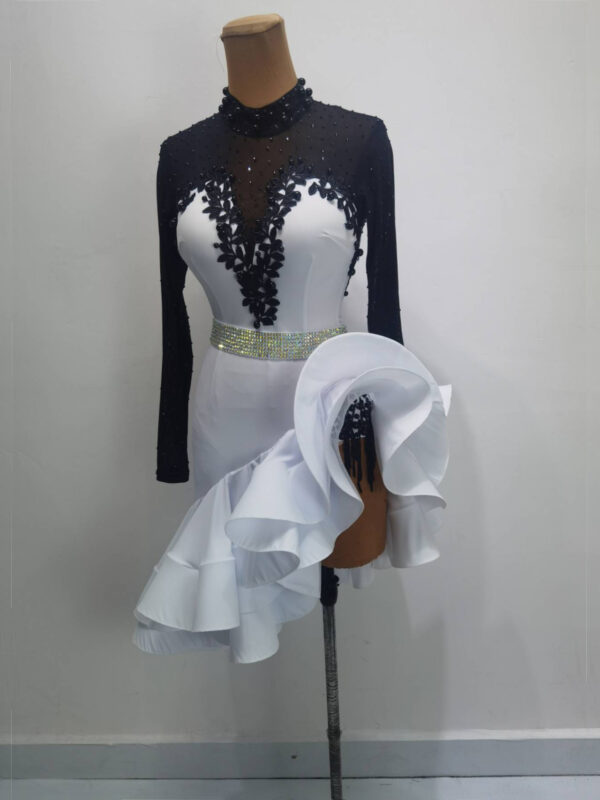 Black and white Latin and Rhythm dance dress with flared skirt and lace.